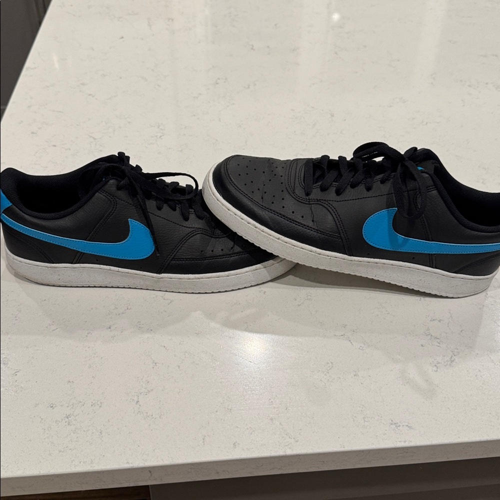 Nike Black Sneakers with Blue Accents